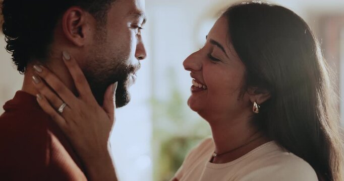 Talking, love and couple in home with care, connection and laughing for healthy relationship. Romance, happy man and woman with funny conversation with partner, marriage commitment and loyalty