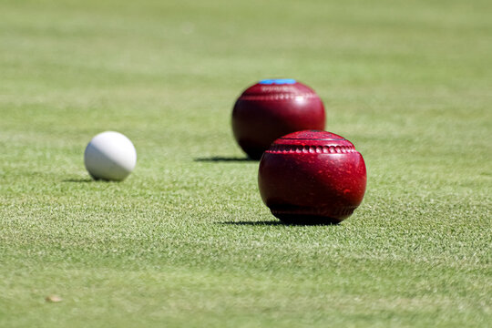 Lawn bowling bowls and a jack ball on the grass on a bowling green in Edinburgh Scotland 