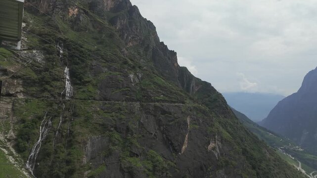 Handheld View Massive Limestone Cliffs on Tiger Leaping Gorge High Trail Yunnan China