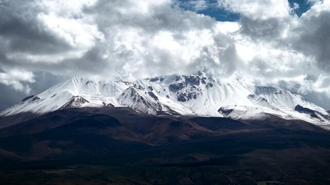 4K aerial drone footage of snowy Taapaca volcano in the Andes mountains