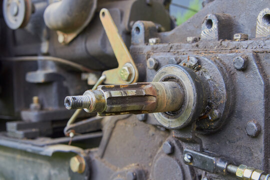 Tractor power take-off (PTO) shaft close-up, Concept of farm equipment maintenance and agri engineering.