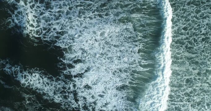 Aerial top view of ocean waves and a sandy beach The Concept of nature and tranquility