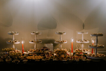 Elegant dessert buffet table with assorted cookies and sweets © Cavan