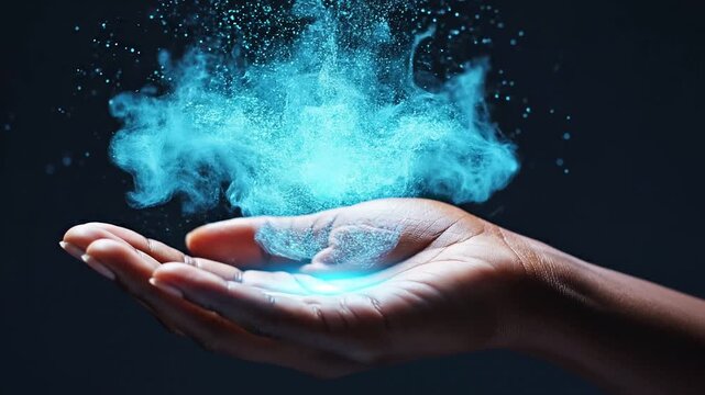 Cloud computing and SaaS data storage innovation through human collaboration. Glowing cloud shape made of luminous blue particles floating above an open palm on a dark navy background.