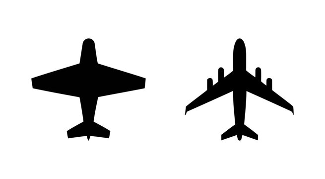 Two airplane silhouettes flying high