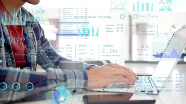 Seated man typing on laptop starting animated charts and data shifting while analyzing data