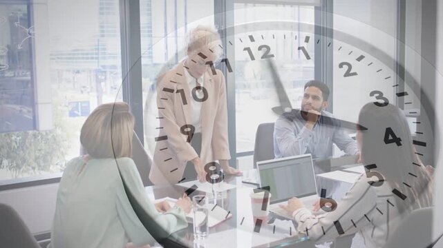 Standing lead starting biz meet pressing decision as team typing on laptop, clock overlay advancing