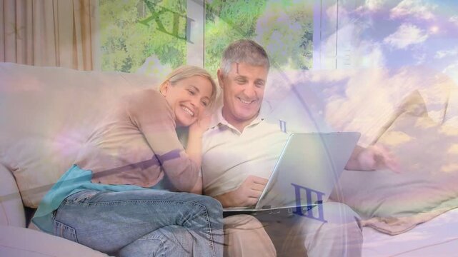 Woman pointing laptop on sofa, couple reviewing tech content and sharing joy with clock overlay