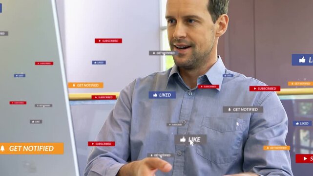 Male pro typing at desk, generating social media badges floating around him for likes, smiling