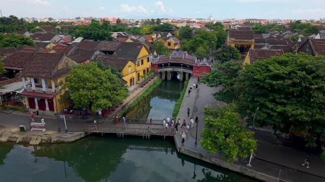 Aerial view of Chua Cau or Japanese Covered ancient Bridge and River in Old city of Hoi An, Vietnam. One of the most travel popular touristic destinations, UNESCO world heritage 