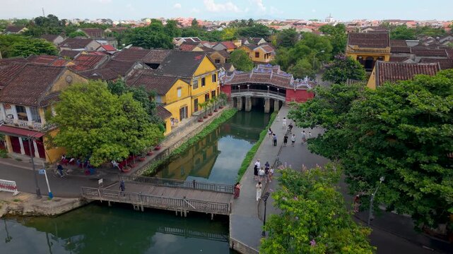 Aerial view of Chua Cau or Japanese Covered ancient Bridge and River in Old city of Hoi An, Vietnam. One of the most travel popular touristic destinations, UNESCO world heritage 