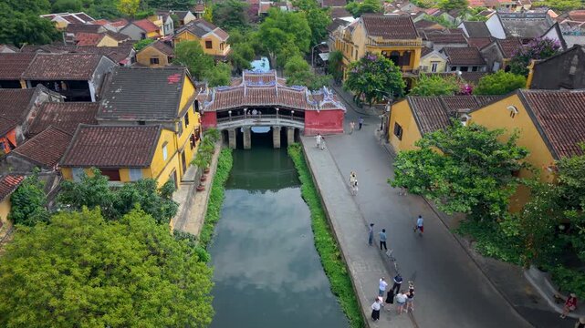 Aerial view of Chua Cau or Japanese Covered ancient Bridge and River in Old city of Hoi An, Vietnam. One of the most travel popular touristic destinations, UNESCO world heritage 