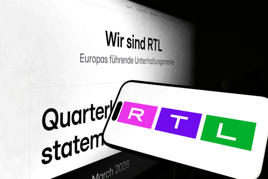 Kiel, Germany - 05-20-2026: Smartphone displaying the German media company RTL app in the App Store in a workspace environment with laptop and notebook