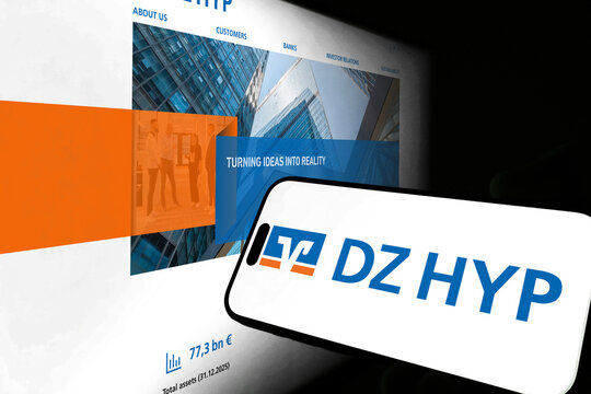 Kiel, Germany - 05-20-2026: Smartphone displaying the German real estate bank DZ HYP AG app in the App Store in a workspace environment with laptop and notebook