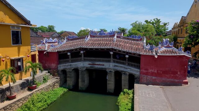 Aerial view of Chua Cau or Japanese Covered ancient Bridge and River in Old city of Hoi An, Vietnam. One of the most travel popular touristic destinations, UNESCO world heritage 