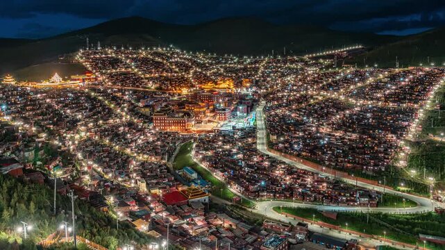 Illuminated Larung Gar Buddhist Academy at Night in Sertar, Sichuan, China in Larung Gar Buddhist Academy, Sertar, Sichuan, China