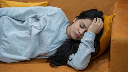 Fototapeta premium Indian Woman Feeling Depressed and Stressed Sitting Alone at Home