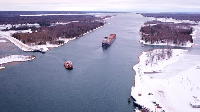 Drone footage looking down at a freighter cruising the St. Marys River