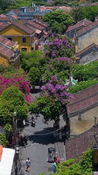 Aerial drone view of Hoi An city, Quang Nam province, Vietnam. Panoramic footage of Ancient town, UNESCO world heritage. One of the most travel popular touristic destinations