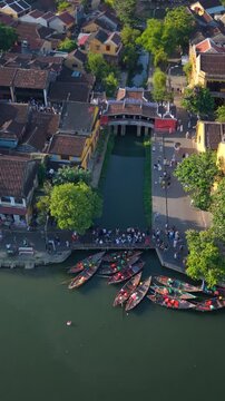 Aerial view of Chua Cau or Japanese Covered ancient Bridge and River in Old city of Hoi An, Vietnam. One of the most travel popular touristic destinations, UNESCO world heritage 
