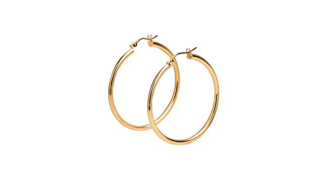 Pair of classic luxury golden hoop earrings fashion jewelry isolated on white background