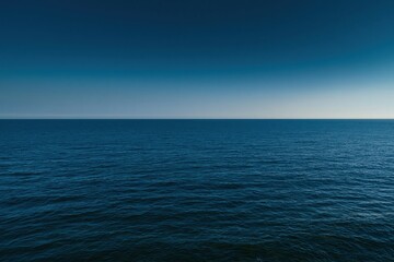 Obraz premium Deep teal ocean horizon and clear sky backdrop for minimal nature lifestyle, coastal travel advertising and expansive background with copy space