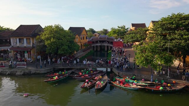 Aerial view of Chua Cau or Japanese Covered ancient Bridge and River in Old city of Hoi An, Vietnam. One of the most travel popular touristic destinations, UNESCO world heritage 
