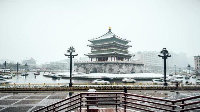 Snowy Xi'an Bell Tower with Winter City Traffic in China in Xi an Bell Tower, Xi an, China