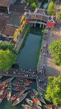 Aerial view of Chua Cau or Japanese Covered ancient Bridge and River in Old city of Hoi An, Vietnam. One of the most travel popular touristic destinations, UNESCO world heritage 