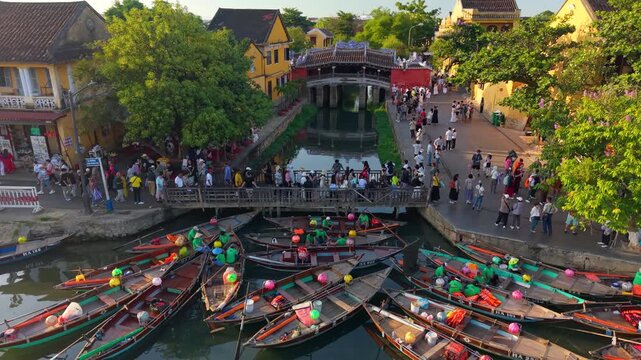 Aerial view of Chua Cau or Japanese Covered ancient Bridge and River in Old city of Hoi An, Vietnam. One of the most travel popular touristic destinations, UNESCO world heritage 