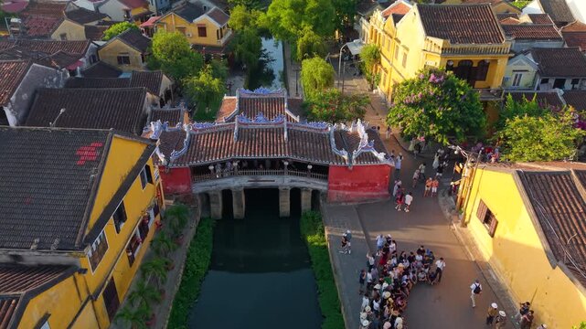 Aerial view of Chua Cau or Japanese Covered ancient Bridge and River in Old city of Hoi An, Vietnam. One of the most travel popular touristic destinations, UNESCO world heritage 