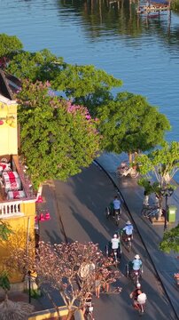 Aerial panoramic view of Hoi An city, Da Nang province, Vietnam. Pedicabs carrying tourists for sightseeing in the old town, UNESCO world heritage. One of the most travel popular touristic destination