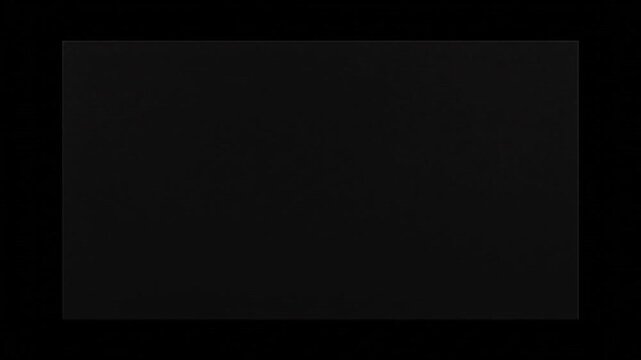 A solid dark gray rectangular surface on a black background