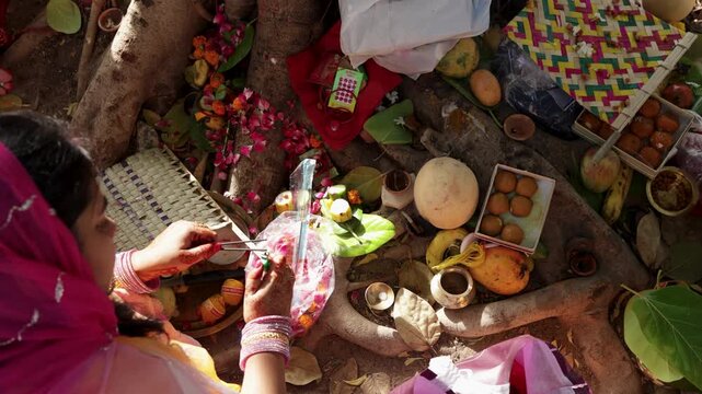 Hindi devotee burning incense sticks during holy rituals at festival ceremony