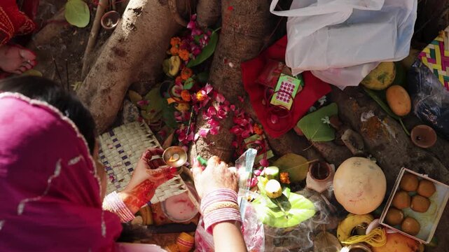hindu woman burning aarti kapur on sacred rituals at the vat savitri festival