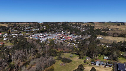 Obraz premium Aerial View of Rural Town Dorrigo Surrounded by Green Farmland