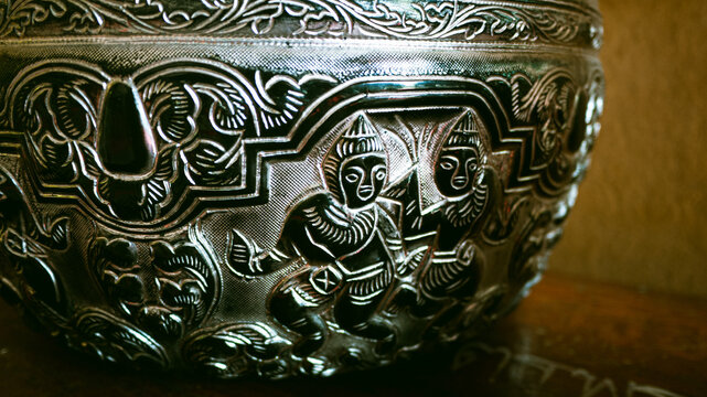 Close up shot of antique 19th century Burmese silver repousse bowl photographed in 2012