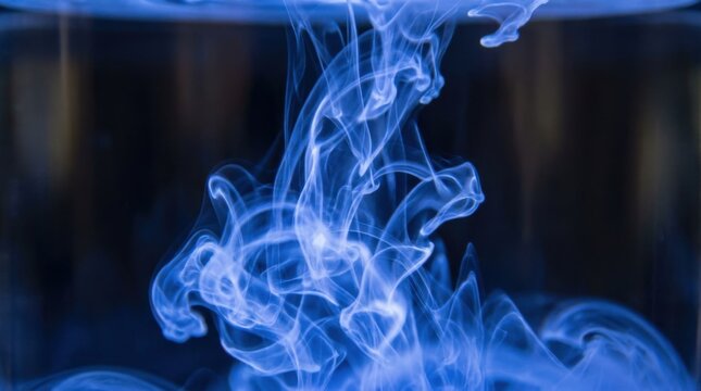 Abstract glowing blue ink swirls with luminescent motion and flowing patterns