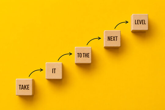 Motivational business growth staircase with take it to the next level message representing career advancement and success achievement