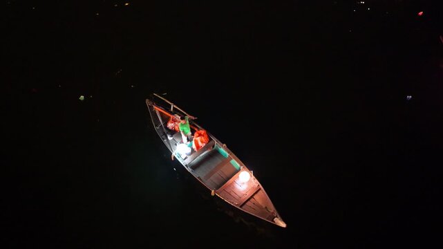 Panorama aerial drone view of Hoi An ancient town with boat tour and beautiful lanterns in night. UNESCO world heritage. One of the most travel popular touristic destinations