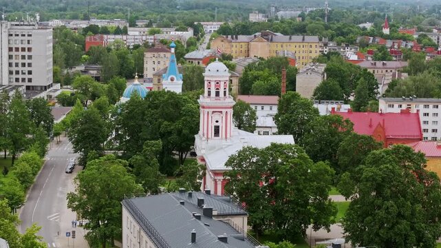 Historic orthodox cathedral and holy trinity church above Jelgava cityscape