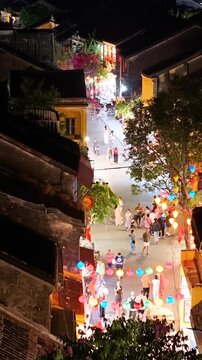 Panorama aerial drone view of Hoi An ancient town with boat tour and beautiful lanterns in night. UNESCO world heritage. One of the most travel popular touristic destinations 