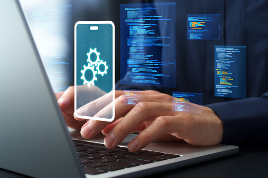 Mobile app development and software engineering. Programming and source code. Engineer coding on laptop computer.
