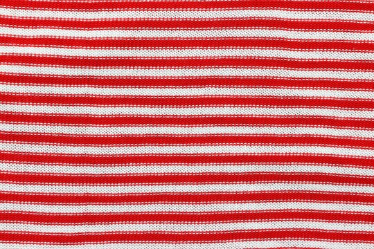 Red and white striped sweater pattern background
