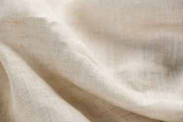 Fototapeta premium Linen fabric texture, natural eco folded linen background. Bio textile material backdrop, canvas top view, close up 