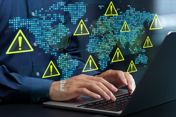 Geopolitical risk analysis. Risk management for global business. World map and warning triangle icons. Businessman evaluating regional tensions on laptop computer. © tadamichi