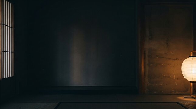 Minimalist Japanese interior with a glowing round paper lantern casting a warm light against a dark textured wall