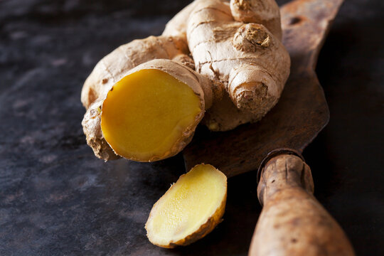 Sliced ginger root on an old knife