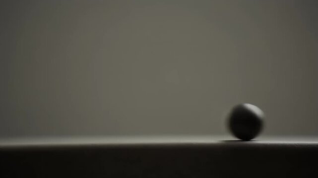Tiny Blurred Orb Gliding Along the Bottom Edge Slowly: Cinematic Abstract Motion Loop (16:9)