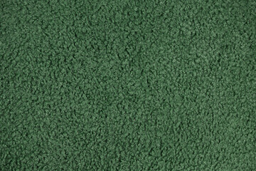 Green curly boucle fabric texture background © MAXSHOT_PL